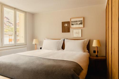 Ένα ή περισσότερα κρεβάτια σε δωμάτιο στο Grand Hotel Belvedere, a Beaumier Hotel