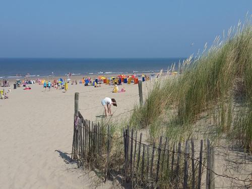 a beach with a lot of people on it at Holiday Home in Noordwijkerhout by Forest & Lake in Noordwijkerhout