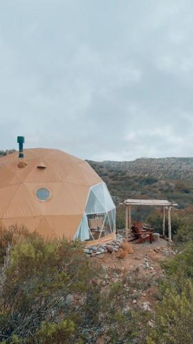 a large dome tent on top of a hill at El Nido Domos in Mendoza