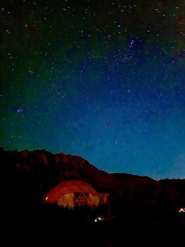 a starry night with a tent in the dark at El Nido Domos in Mendoza