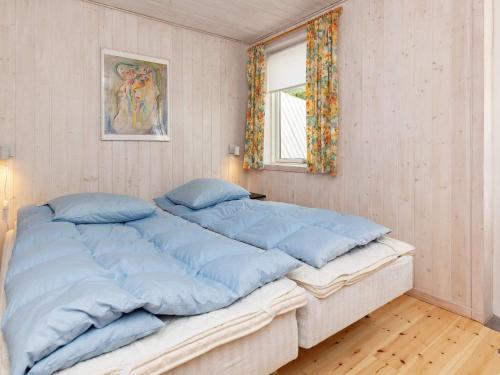 Ένα ή περισσότερα κρεβάτια σε δωμάτιο στο 6 person holiday home in Højslev-By Traum
