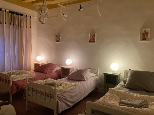 Ένα ή περισσότερα κρεβάτια σε δωμάτιο στο Villa Krystina Gîte de Charme