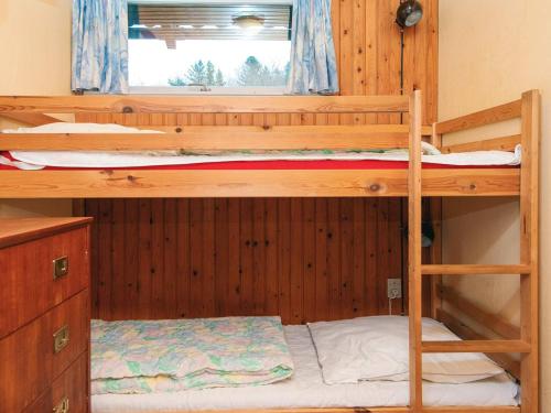 two bunk beds in a room with a window at 5 person holiday home in Silkeborg-By Traum in Silkeborg