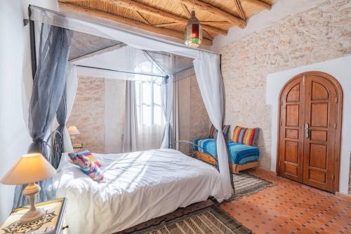 Ένα ή περισσότερα κρεβάτια σε δωμάτιο στο Villa Fleurie