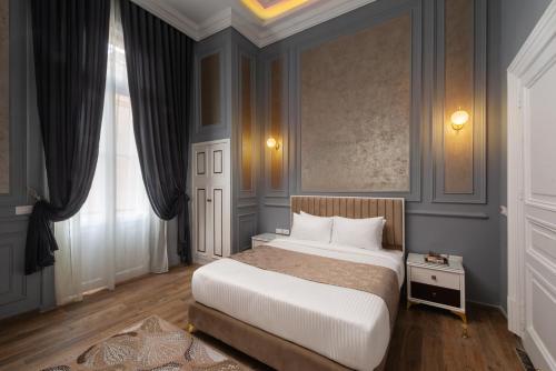 Postel nebo postele na pokoji v ubytování Sayed Effendi - Boutique Hotel