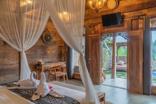 Ένα ή περισσότερα κρεβάτια σε δωμάτιο στο Villa Gong Sebatu