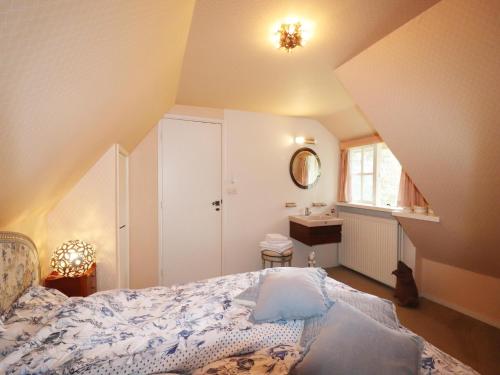 a bedroom with a bed and a sink in it at Villa in Ommen with Private Pond in Rheezerveen