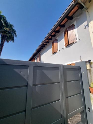 a black garage door in front of a house at DA ARTU' in Udine