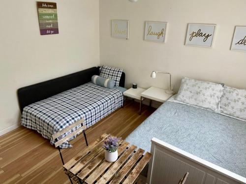 a living room with a bed and a couch at Beautiful suite in the best location in Miami! in Miami