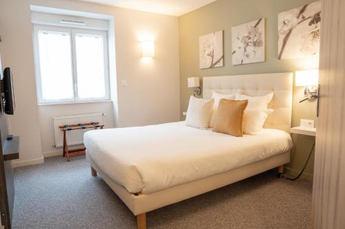 Postel nebo postele na pokoji v ubytování Hôtel restaurant Vertfeuille