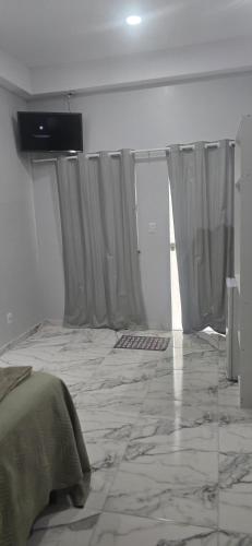 TV a/nebo společenská místnost v ubytování Pousada Meu Refúgio