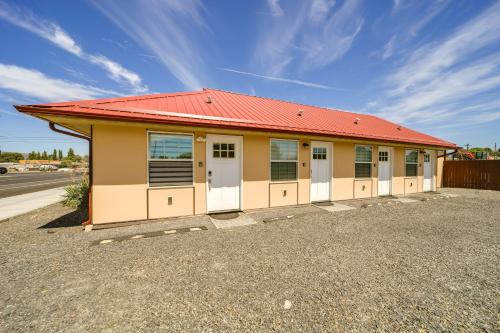 a small building with a red roof at Steps to Soap Lake Studio Stay with Patio! in Soap Lake