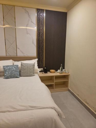 a bedroom with a large bed and a window at ROYAL Village Dhangethi Maldives in Male City
