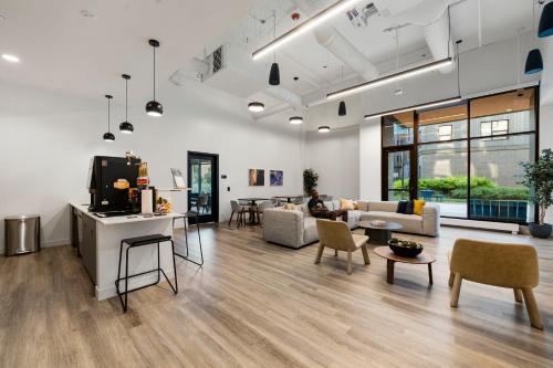 a living room with a person sitting on a couch at Family-Sized 4BR Luxury in Downtown Chicago in Chicago