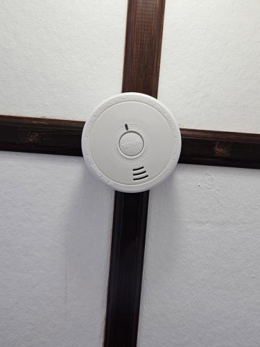a white frisbee is attached to a wall at Sunrise Haven Holiday Apartments Barbados in Christ Church