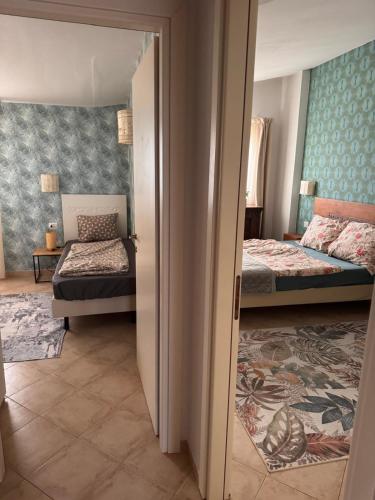 Llit o llits en una habitació de Tropical Anzso