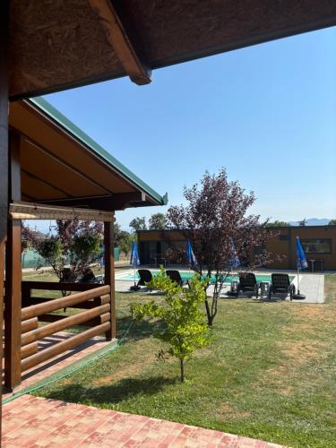a pavilion with a fence in a yard at Naša Oaza - Donja Trepča, Čačak 