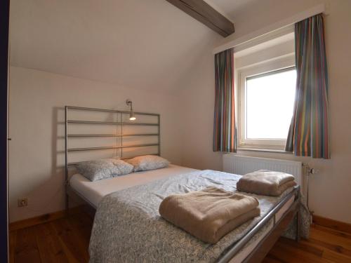 Katil atau katil-katil dalam bilik di Holiday Home in Heppenbach with garden
