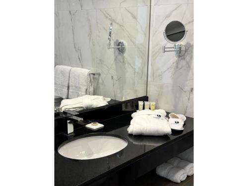 a bathroom with a sink and a shower at Best Western Plus Urban Larco Hotel in Lima