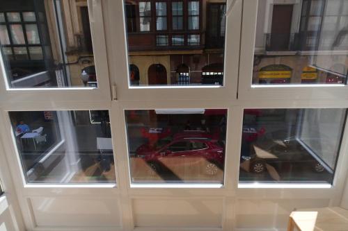 a display case with a red toy car in it at bcool in Bilbao