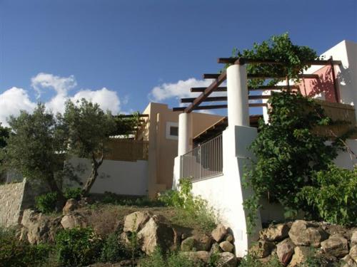 a white building on top of a rocky hill at Villa Hermes Case Vacanza in Lipari