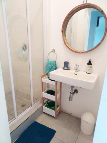 a bathroom with a sink and a shower at Umdloti Holiday Resort 607 in Umdloti