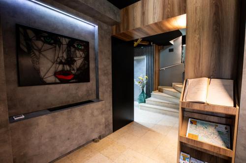 a hallway with a staircase with a stained glass window at View Inn Boutique Hotel in Skopje