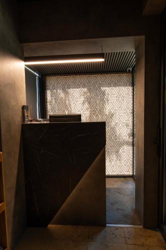 a kitchen with a black counter and a window at View Inn Boutique Hotel in Skopje