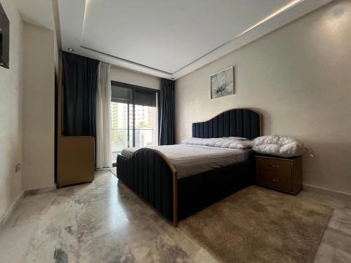 Una cama o camas en una habitación de Haut standing - emplacement idéal