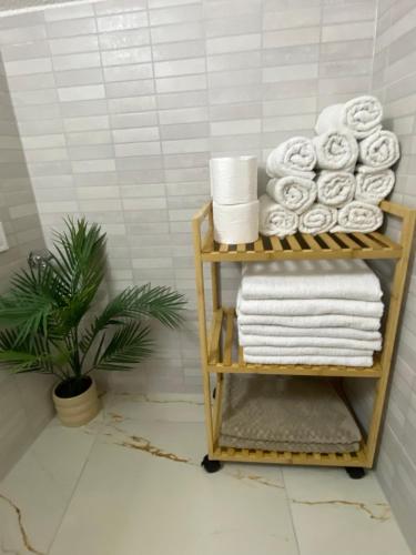 a towel rack with towels on it in a bathroom at NERi in Koper