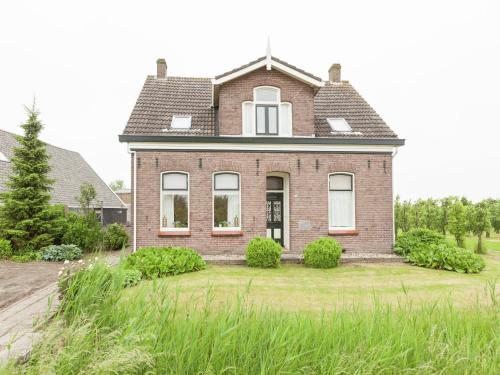 a brick house with a gambrel roof at leisure retrete with costal nature in Wemeldinge