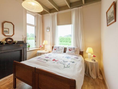 a bedroom with a bed and a large window at leisure retrete with costal nature in Wemeldinge