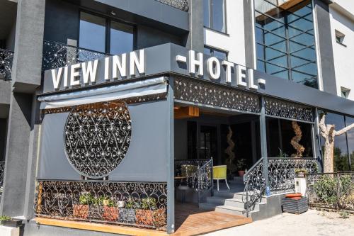 a facade of a hotel with a sign that reads view inn hotel at View Inn Boutique Hotel in Skopje
