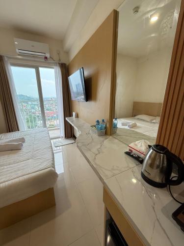 Μια τηλεόραση ή/και κέντρο ψυχαγωγίας στο Citra Plaza Studio Near Nagoya Hill