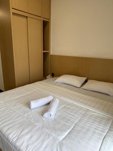 Ένα ή περισσότερα κρεβάτια σε δωμάτιο στο Citra Plaza Studio Near Nagoya Hill