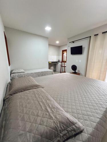 Ένα ή περισσότερα κρεβάτια σε δωμάτιο στο Thomaz House Macapaz