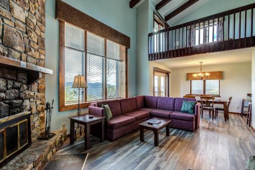 a living room with a couch and a fireplace at The Highlands at Sugar in Banner Elk