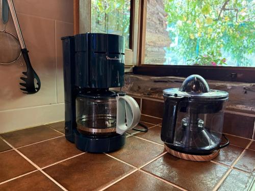 a coffee maker sitting on a counter in a kitchen at Casa Rural Picón in Ocero