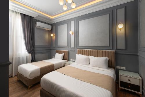 Postel nebo postele na pokoji v ubytování Sayed Effendi - Boutique Hotel