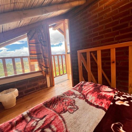 Cama o camas de una habitación en Hostal Doña Clarita Inn