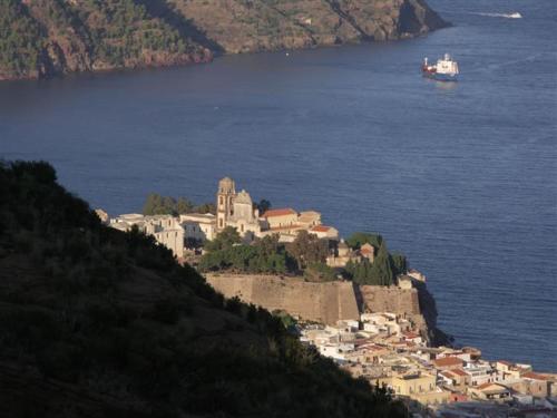 a town on top of a hill next to the water at Villa Hermes Case Vacanza in Lipari