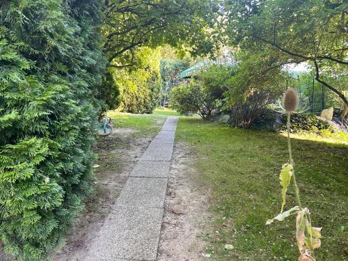 a path in a park with a person walking down it at Luxor in Havířov