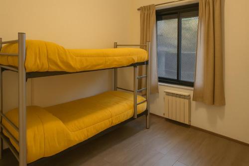 Katil atau katil-katil dalam bilik di Quinba Hostel