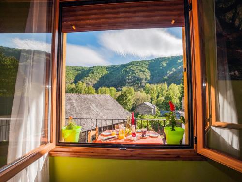 a window with a view of a mountain view at Apartment in La Omañuela in La Omañuela