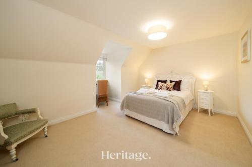 a bedroom with a bed and a chair at Bonnieview House, Tarves, Aberdeenshire 