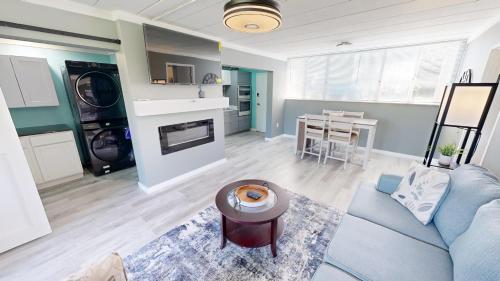 a living room with a blue couch and a table at Sea Palm 2B condo in Fort Walton Beach