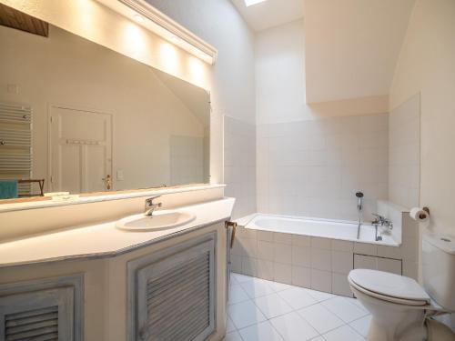 a bathroom with a sink and a toilet and a tub at Elegant Seaside Villa in Èze in Èze