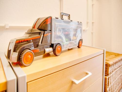 a toy dump truck sitting on top of a dresser at Holiday Home in Kilder near Bergherbos in Kilder