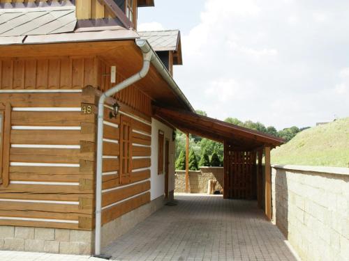 a wooden building with a walkway leading into it at Peaceful Mountain Holiday Stay in Stupná