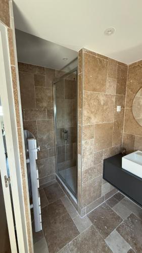a bathroom with a shower and a sink at Le joli strasbourgeois in Caen